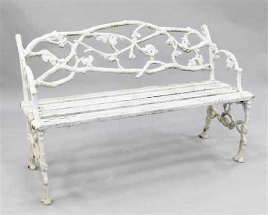 A Victorian rustic white painted cast iron garden bench, W.4ft 4in.